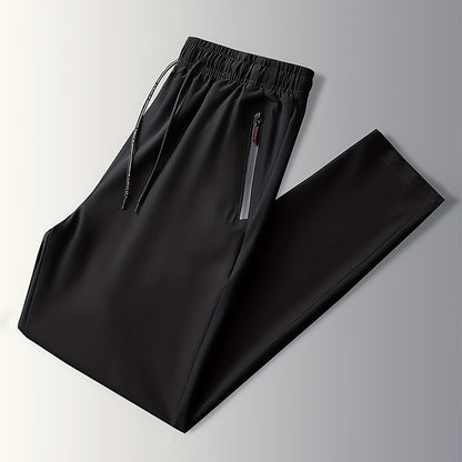 Schwarze Jogginghose mit Reißverschlusstaschen, elastischer Bund, Sportbekleidung Herren.
