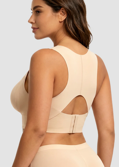 Baksida pĂĽ beige bh med racerback, rund urskĂ¤rning i ryggen och hakar i ryggbandet, sedd frĂĄn sidan. 3