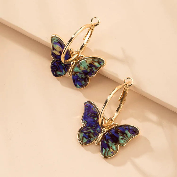 Goldene Schmetterling-Ohrringe mit blau-grünem Muster, modischer Schmuck für Damen.
