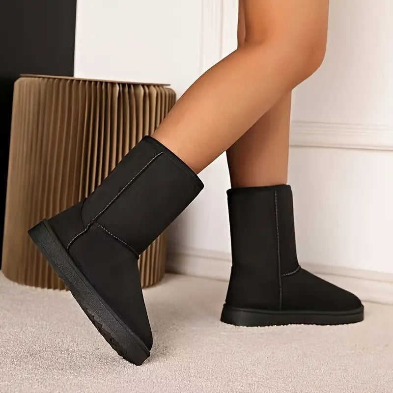 Schwarze Damen-Winterstiefel aus Leder, knöchelhoch, rutschfeste Sohle, modisch und warm.