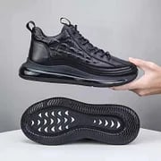 Schwarze Air-Cushion-Sneaker, rutschfeste Sohle, modisches Design, bequeme Sportschuhe.