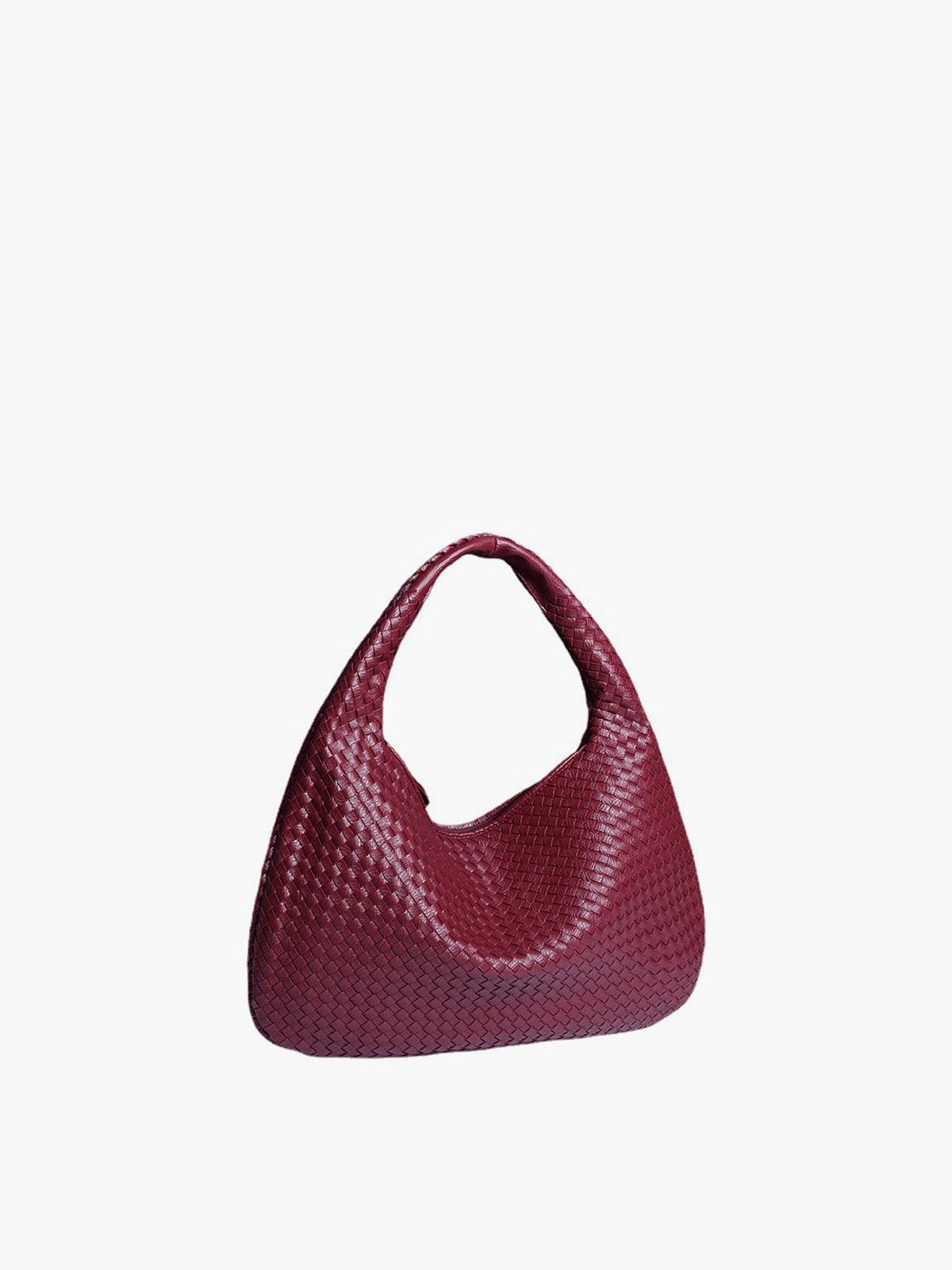 Rote geflochtene Handtasche aus Leder, modisches Accessoire, Damenmode, elegant und stilvoll.