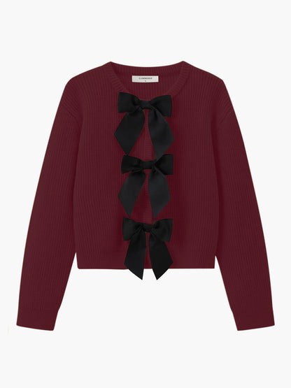 Damenpullover bordeaux mit schwarzen Schleifen, Strick, elegant, modisch, Herbstmode.