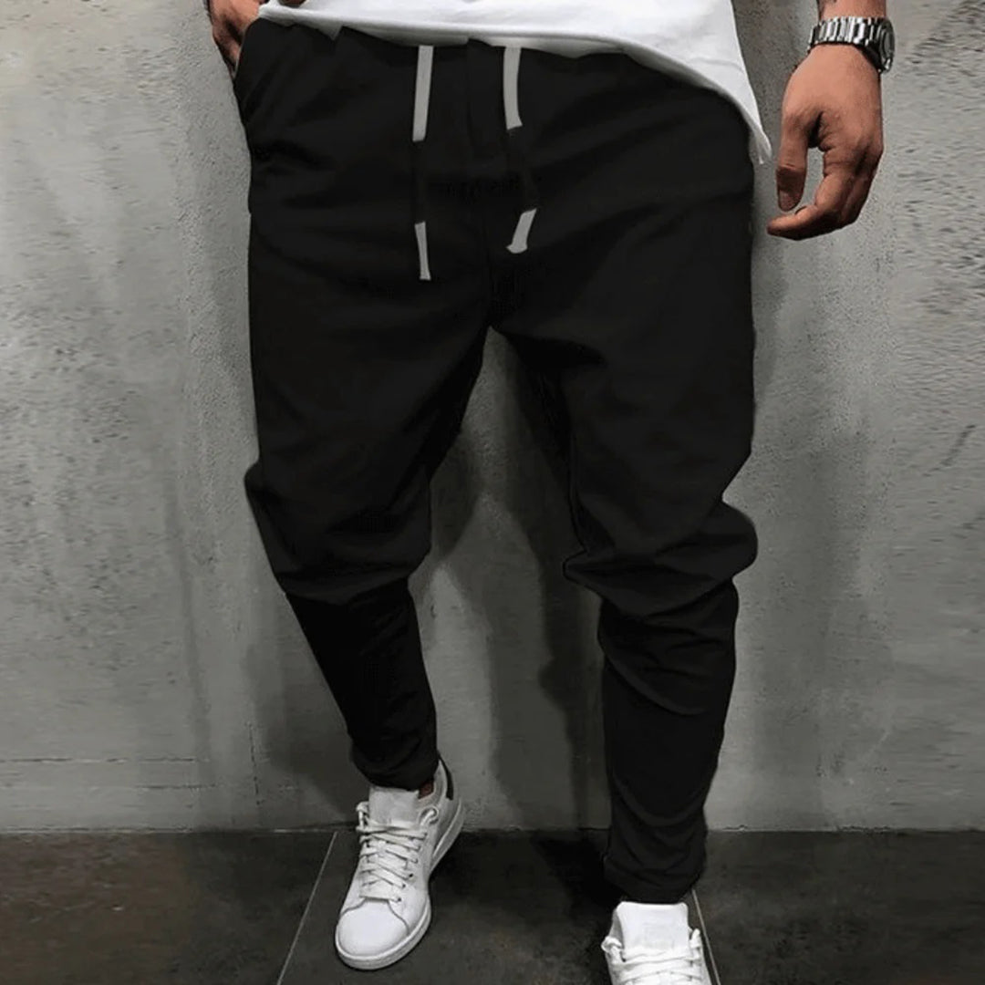 Schwarze Jogginghose Herren, Kordelzug, bequem, sportlich, Freizeitmode, Streetwear.
