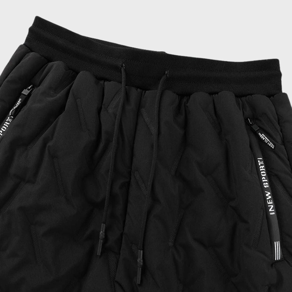 Schwarze Jogginghose mit Kordelzug, Reißverschlusstaschen, sportlich, bequem, Herrenmode.