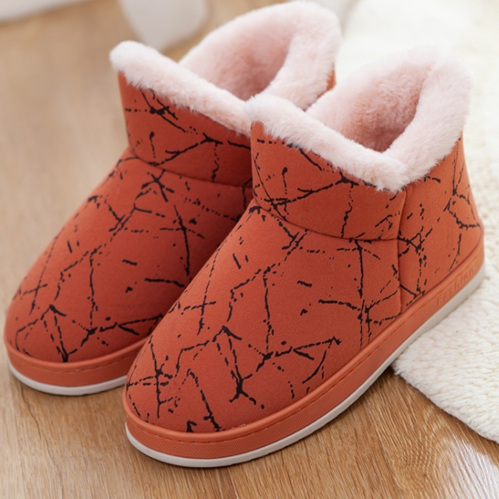 Orange Damen-Hausschuhe mit schwarzem Muster und rosa Futter, warm und bequem.