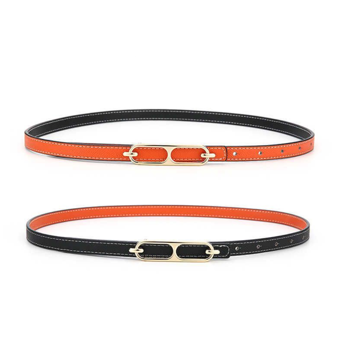 Zwei Ledergürtel, orange und schwarz, mit goldener Schnalle, modisches Accessoire.