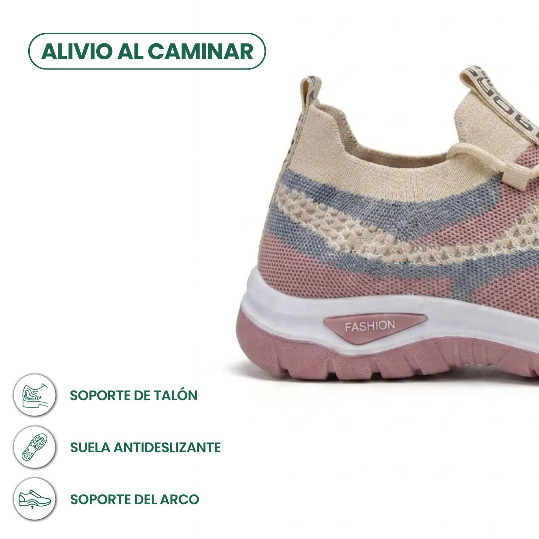 Närbild på hälpartiet av den beige sneakern med rosa och blå fält, med ikoner för häl- och hålfotsstöd. 31