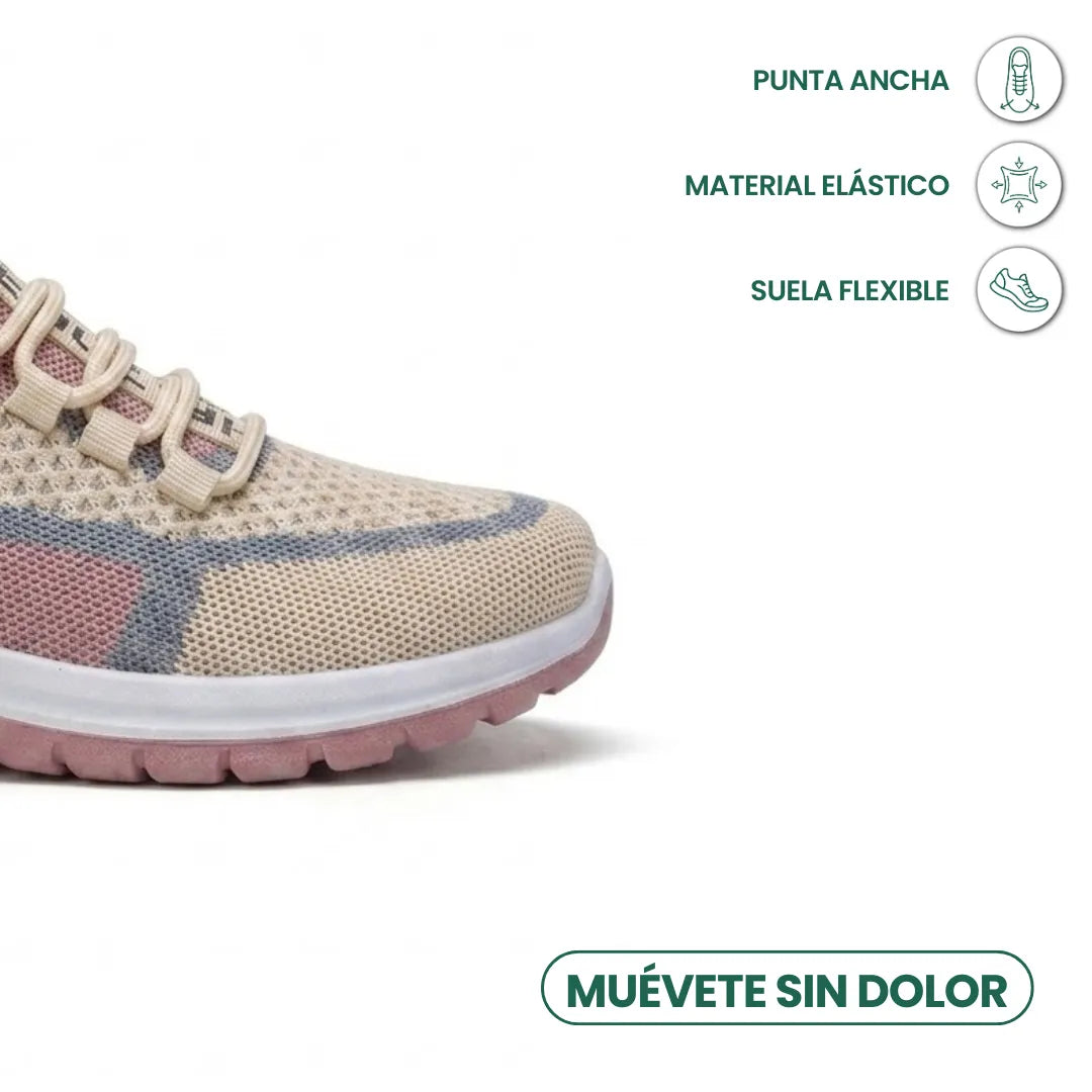 Närbild på den breda tåpartin av den beige sneakern i elastiskt mesh med böjlig sula. 32