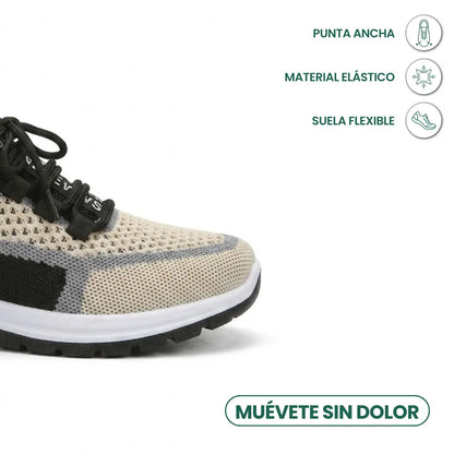Närbild på sneakerns breda tåparti i beige mesh med svarta och grå partier, vita sulan och svarta snören, med ikoner för egenskaper. 41