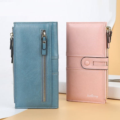 Zwei Damen-Lederportemonnaies mit Doppelreißverschluss, blau und rosa, elegant und stilvoll.