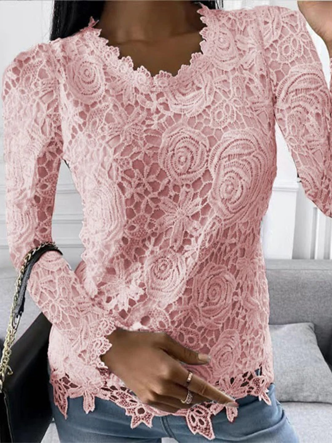 Damenoberteil aus rosa Spitze, langärmelig, florales Muster, elegantes Design, modisch.