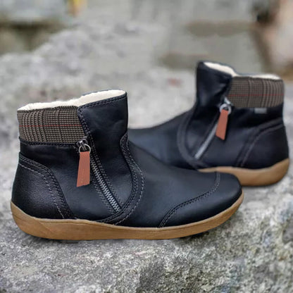 Schwarze Damenstiefeletten mit Reißverschluss, Lederoptik, rutschfeste Sohle, modisch.