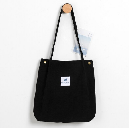 Schwarze Stofftasche mit langen Henkeln, minimalistisches Design, ideal für den Alltag.