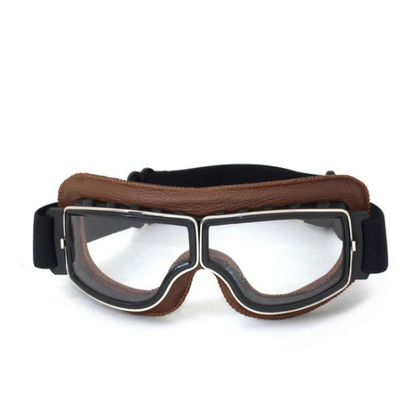 Braune Vintage-Motorradbrille mit schwarzem Rahmen und klarem Glas für Retro-Stil.