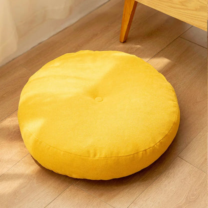 Gelbes rundes Bodenkissen für Meditation und Yoga, geeignet als Sitzpolster oder Pouf.