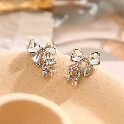 Silberne Ohrringe mit Kristallschleife und Sternanhänger, modisch, elegant, für Damen.