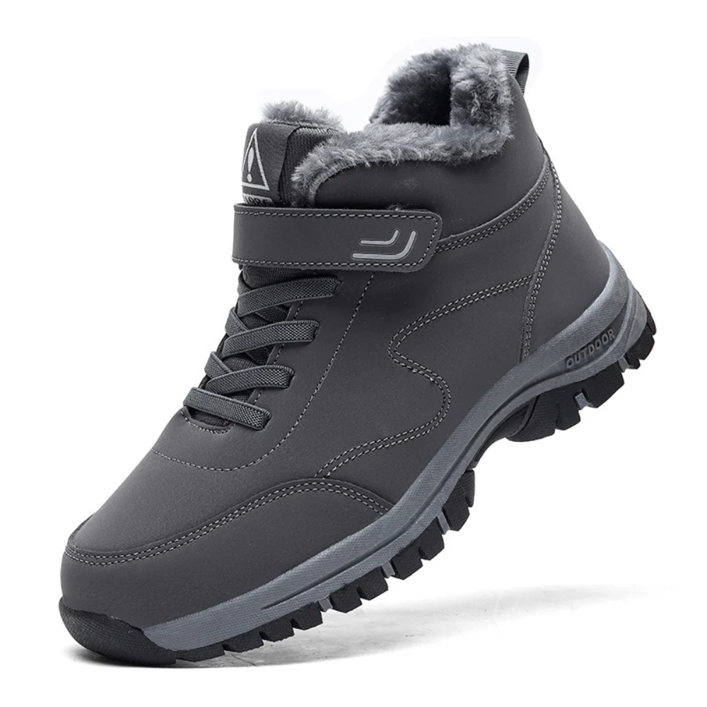 Graue Winterstiefel mit Fellfutter, rutschfeste Sohle, Outdoor-Schuhe für kaltes Wetter.