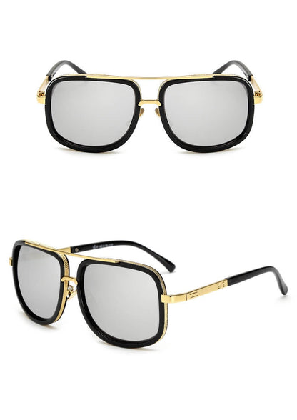 Schwarze Sonnenbrille mit goldenen Akzenten, rechteckige Gläser, modisches Accessoire.