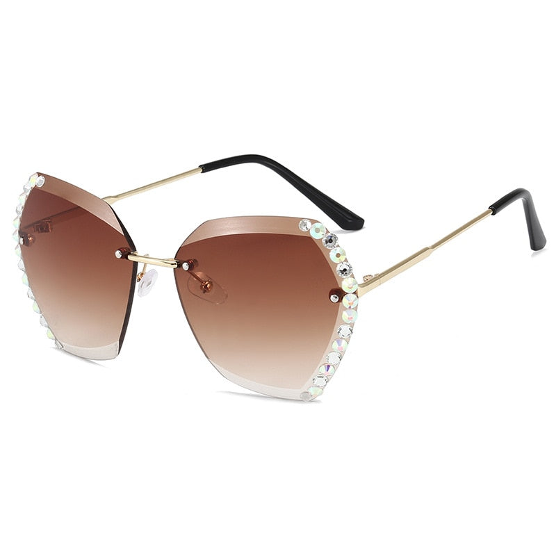 Damen Sonnenbrille mit Strass, braune Gläser, goldene Bügel, modisch, UV-Schutz.