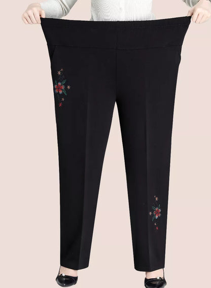 Schwarze Damenhose mit Blumenstickerei, elastischer Bund, elegant, bequem, modisch.