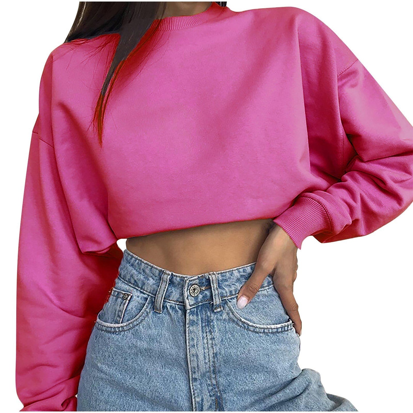 Damen pinker Crop-Pullover, langärmelig, Baumwolle, modisch, lässig, über Jeans getragen.