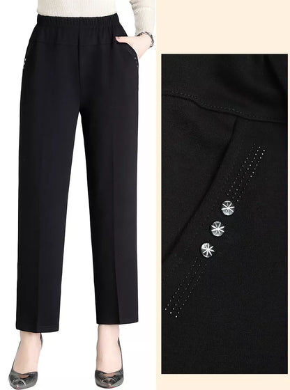 Schwarze Damenhose mit elastischem Bund und dekorativen Sternknöpfen, elegant und bequem.
