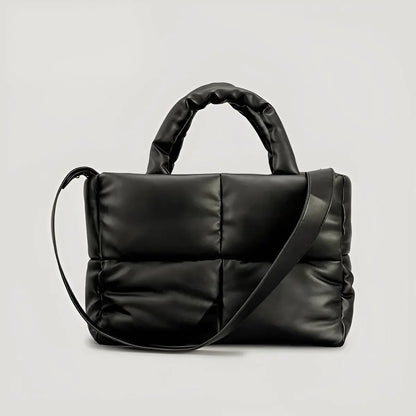 Schwarze gesteppte Handtasche aus Leder mit Schulterriemen, modisch, elegant, Damenaccessoire.
