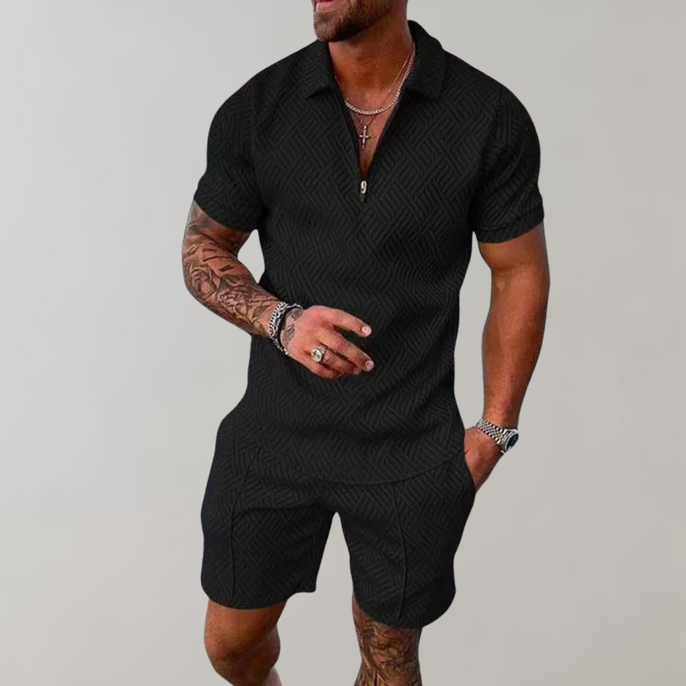 Mann in schwarzem Kurzarm-Overall, elegantes Design, Sommermode für Herren.