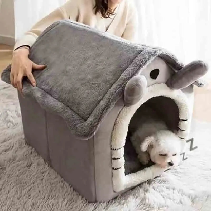 Graue Indoor-Hundehütte aus weichem Material mit abnehmbarem Kissen, geeignet für kleine Hunde.