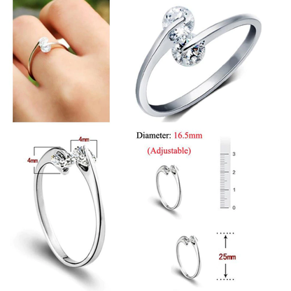 Silberner verstellbarer Ring mit zwei klaren Kristallen, elegantes Schmuckdesign für Damen.