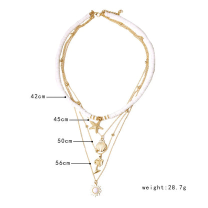 Goldene Halskette mit Muschel- und Seesternanhängern, mehrlagig, 42-56cm, 28,7g.