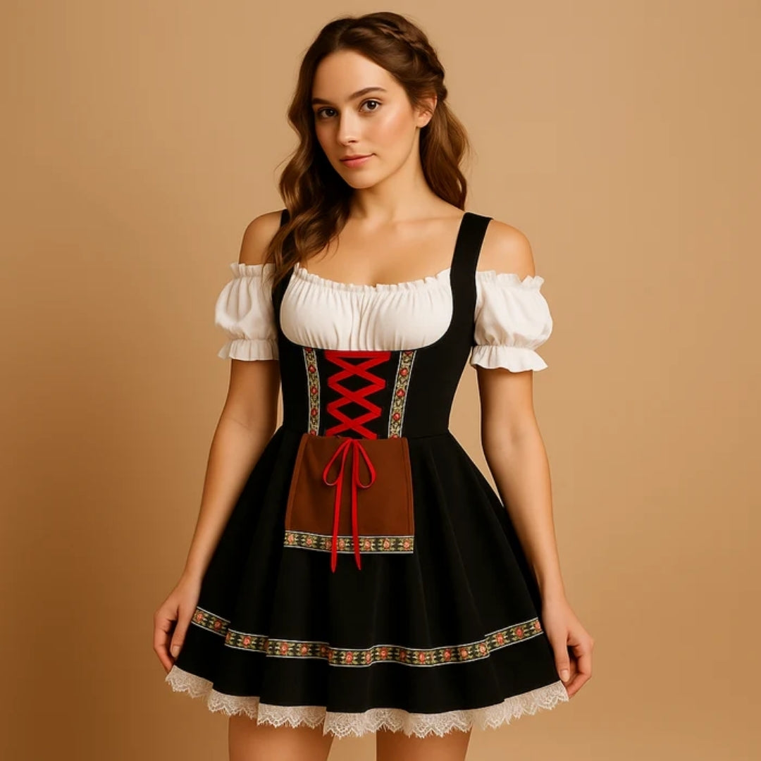 Kvinna i svart dirndl med röd snörning, brunt förkläde, blommigt band och vit spetskant, med flätad hårdetalj och off-shoulder-blus. 7
