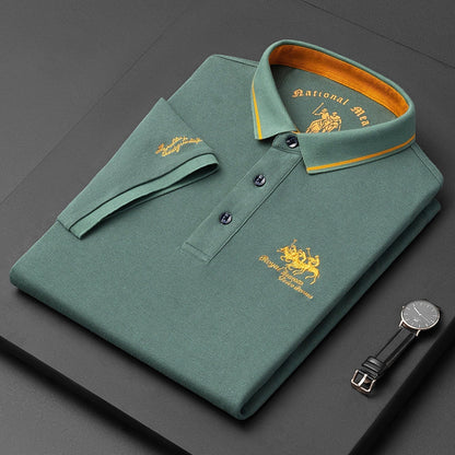 Graues Polohemd mit gelber Stickerei, Baumwolle, Herrenmode, elegantes Design.