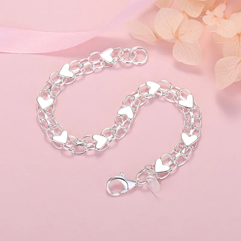 Silberarmband mit Herzanhängern, Damen Schmuck, romantisches Geschenk, modisch, elegant.