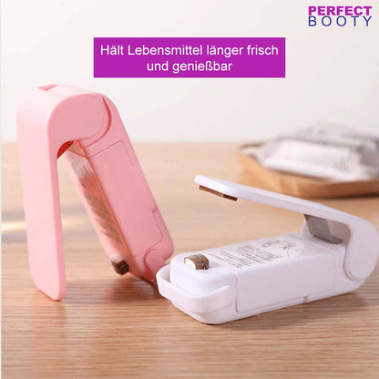 Tragbare Mini-Wärme-Taschenversiegelungsmaschine, rosa und weiß, für Lebensmittelverpackungen.