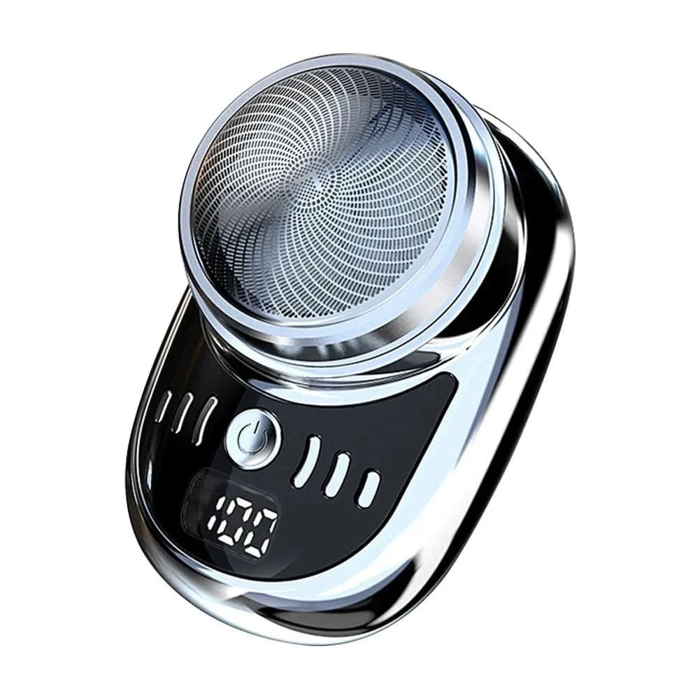 Rakapparat i silver och svart med rund rakskärm, strömknapp och digital batteriindikator på vit bakgrund. 6