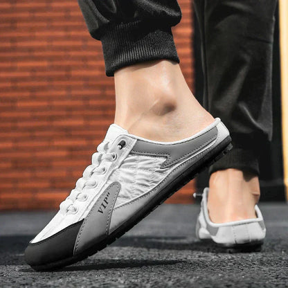 Weiße Herren-Sneaker mit schwarzer Sohle, lässiger Stil, ideal für Sommermode.