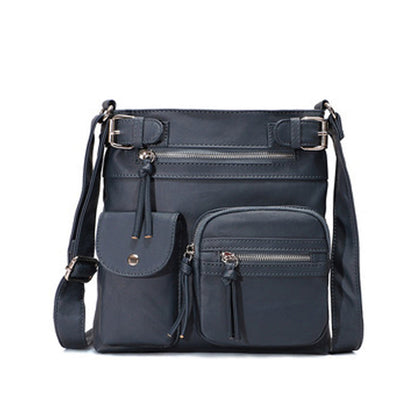 Dunkelblaue, multifunktionale, modische Anti-Diebstahl-Tasche aus Leder mit mehreren Fächern.