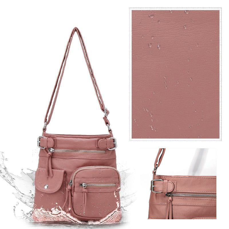 Rosa, wasserdichte, multifunktionale Anti-Diebstahl-Tasche mit mehreren Reißverschlusstaschen.