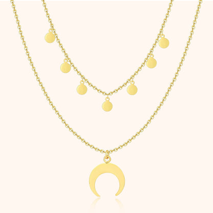 Goldene Halskette mit Halbmond-Anhänger und runden Anhängern, modischer Schmuck.