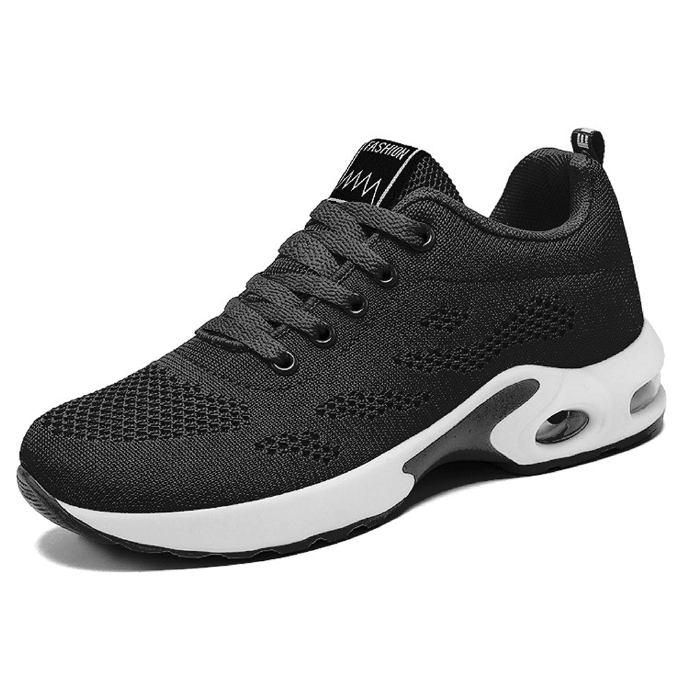 Schwarzer Sportschuh mit weißer Sohle, atmungsaktives Mesh, ideal für Laufen und Fitness.