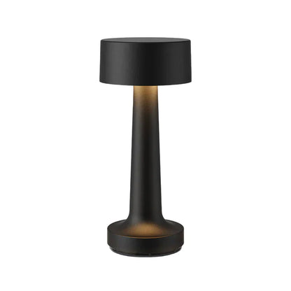 Schwarze zylindrische Tischlampe, kabellos, ideal für Restaurant oder Bar, modernes Design.