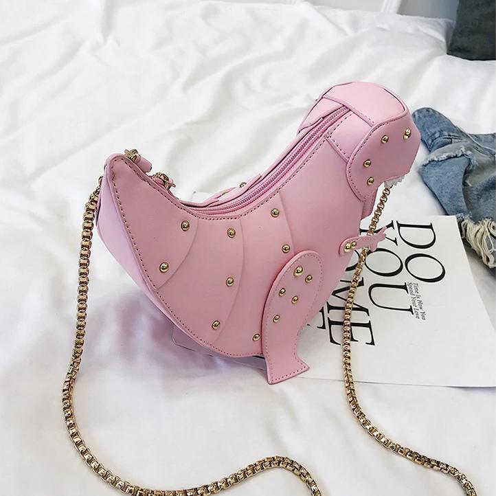 Rosa Dinosaurier-Handtasche aus Leder mit goldener Kette, modisches Accessoire für Damen.