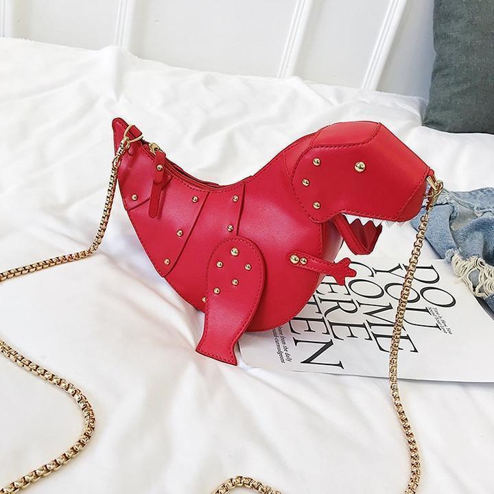 Rote Dinosaurier-Handtasche aus Leder mit goldener Kette, modisches Accessoire für Damen.