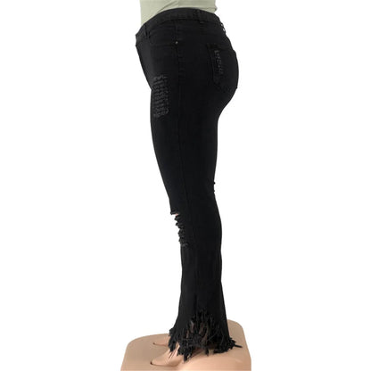 Schwarze Damenjeans mit Fransen, Slim Fit, modisch, aus Baumwolle, seitliche Ansicht.
