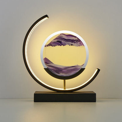 Moderne Sanduhrlampe mit LED-Beleuchtung, runder Rahmen, lila Sand, dekorative Tischleuchte.
