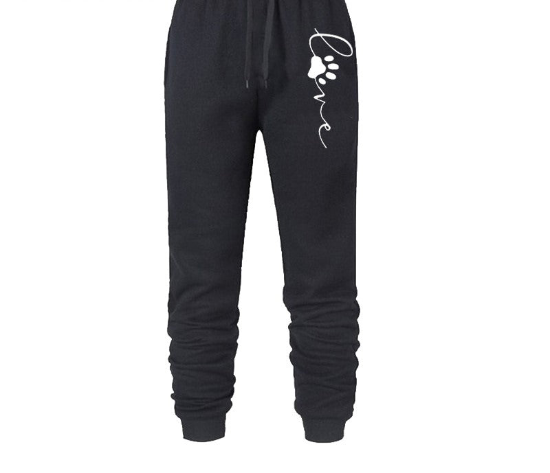 Schwarze Jogginghose mit "Love"-Aufdruck und Pfotenmotiv, bequem, Baumwolle, Damenmode.