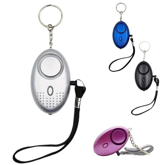 Persönlicher Alarm Schlüsselanhänger, oval, silber, blau, schwarz, lila, Sicherheitsgerät.