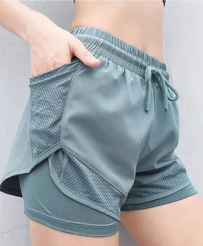 Andningsbara & Snabbtorkande Högmidjade Träningsshorts Dam – Mira
